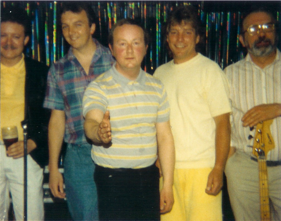1986 at The Poplar. Very nearly the start of Sixties Mix. This band was known as 'The Over The Hill Gang'. Left to right: Ernie (drums), Terry, Brian, Dave Stead (bass player and Poplar landlord) and Ricky Brooks (bass player)